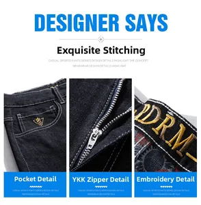 Detail of loose fit jeans showing the YKK zipper and embroidered waist branding