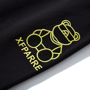 Pantalon de jogging homme avec broderie ours jaune et détails en strass