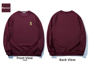 Close-up of burgundy sweatshirt showing embroidered bear detail and ribbed cuffs