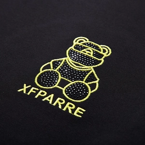 Black sweatshirt with teddy bear embroidery and rhinestones featuring XFPARRE lettering