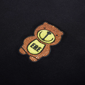 Oversized black sweatshirt featuring detailed bear embroidery and rhinestone accents
