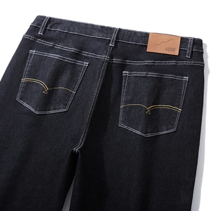 Mens relaxed fit dark charcoal jeans with mountain embroidery and active leather patch