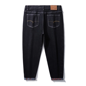 Loose straight-leg men's dark blue jeans with embroidered back pockets and printed cuffs