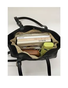 Top-down view of large black tote bag interior showing spacious capacity and lining