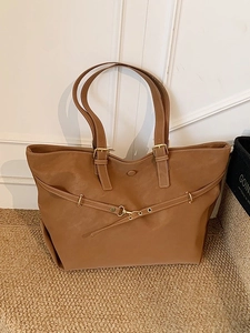 Brown minimalist large tote bag with gold metal buckles and stylish horizontal strap detail