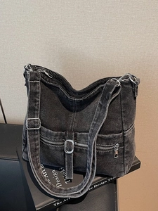 Vintage black denim tote bag with contrast stitching and adjustable wide shoulder strap