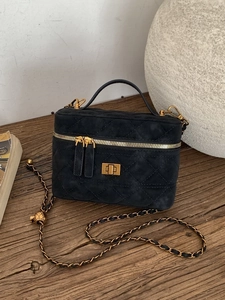 Elegant black quilted suede handbag with vintage gold hardware and chain strap
