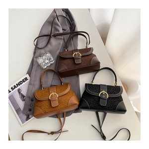 Detailed comparison of vintage saddle bags in three colors with gold horseshoe buckles