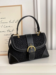 Chic black leopard print handbag with contrast stitching and large gold buckle closure