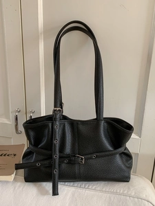 Vintage black lychee pattern leather tote bag with decorative belts and metal buckles