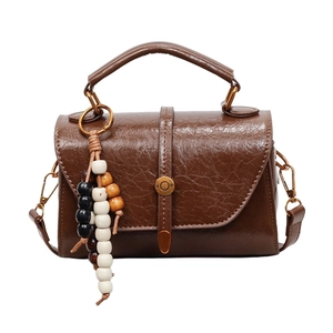 Vintage dark brown Boston bag with wooden beads and adjustable shoulder strap