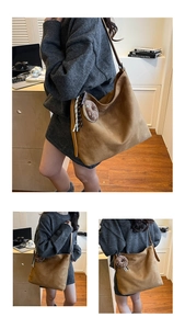 Detail of a brown suede Hobo bag featuring a donut charm and striped fabric tassels