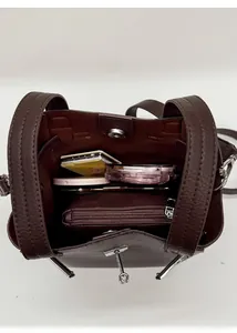 Interior view of brown lychee leather bucket bag showing spacious storage and magnetic closure