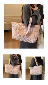 Close-up of pink quilted puffer tote bag with elegant white cursive embroidery details