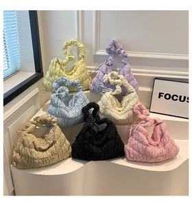 Detailed display of seven color options for the quilted nylon cloud shoulder bag