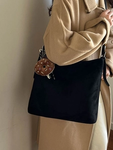 Large black minimalist tote bag in suede texture with a cute donut plush charm for women