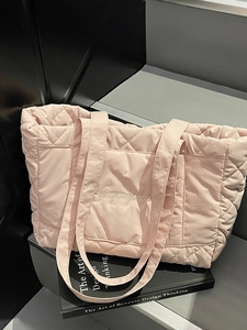 Pink quilted tote bag with Gugugugu embroidery and wide strap for daily commute