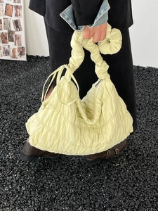Fashionable pale yellow quilted nylon cloud shoulder bag with knotted handle for women