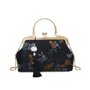 Elegant Chinese vintage evening bag with gold floral embroidery and metallic ring handle