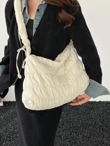 Chic beige quilted nylon cloud shoulder bag with spacious design and drawstring details