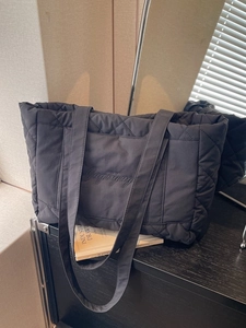 Chic black quilted tote bag with diamond pattern and embroidery for winter daily commute