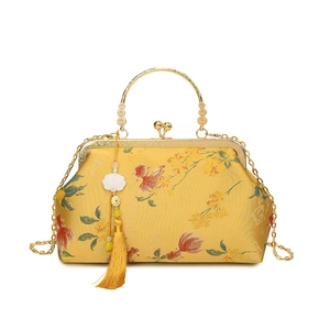 Elegant Chinese shell bag with gold embroidery, yellow silk finish and floral tassel
