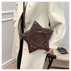 Detail of star-shaped dark brown PU leather tote with rivets and star embossed pattern