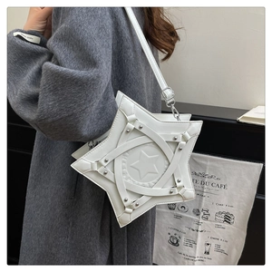 Detail of white star-shaped shoulder bag with silver rivets and embossed star pattern