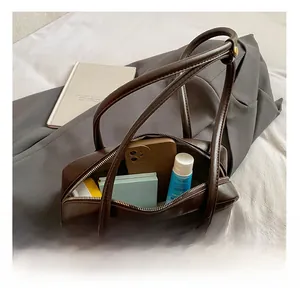 Interior view of deep brown vintage tote bag showing large capacity for essentials