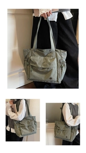Detailansicht der großen salbeigrünen Nylon-Tragetasche mit Taschen und gewebten Gurten