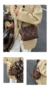 Detail of dark brown woven handbag with wooden bead tassel and detachable shoulder strap
