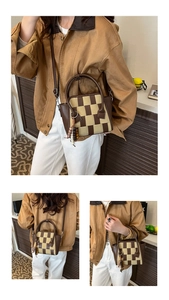 Detail of checkered woven crossbody bag with leather handles and beaded tassel charm