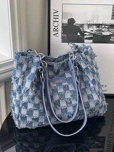Blue and white checkered tote bag with fringed denim edges and purple leather straps