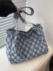 Blue and white checkered tote bag with frayed edges and silver metal chain handles
