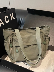 Olive green nylon tote bag with multi-pocket design for casual daily commuting