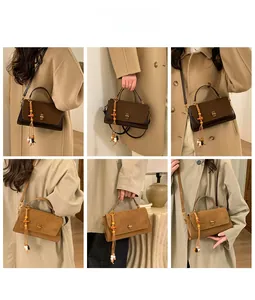 Detail shots of matte suede crossbody bags in coffee and camel with wooden bead tassels