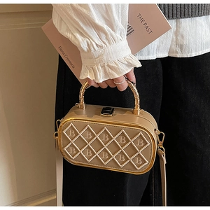 Detail of khaki leather mini bag with metal B-letter stitching and woven handle