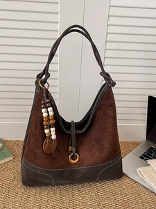Brown faux suede tote bag with leather patchwork and elegant beaded tassel detail