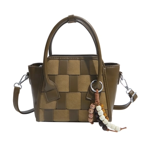 Vintage woven small square handbag in olive green and camel suede with a beaded pendant