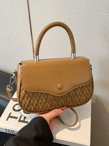 Chic brown vegan leather crossbody bag with quilted weave texture and top handle