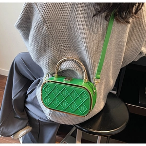 Close-up of green quilted PU crossbody bag with B-letter embossing and metal handle