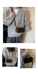 Chic black vintage box bag featuring gold metal handles and quilted diamond patterns