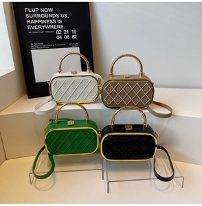 Chic box bags in four colors with quilted 'B' logo and metallic top handles