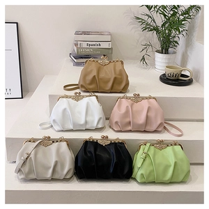Close-up of pleated cloud bags in six colors featuring pearl floral metal clasps