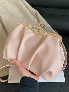 Pink pleated cloud bag with rhinestone butterfly clasp and gold metal frame for women