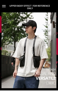 Tactical black PU leather chest bag with adjustable straps in a street style setting