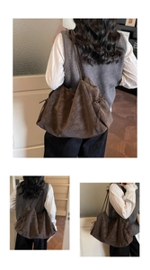 Close-up of the vintage tote bag showing drawstring details and embossed texture