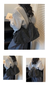 Detail of matte black leather tote bag with pleated texture and side drawstring accents