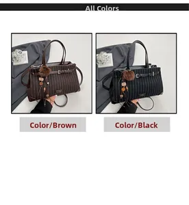 Detail view of coffee and black pinstripe handbags with fur ball and wood bead charms