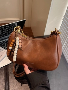 Brown retro half-moon underarm shoulder bag with wooden bead charm and metal zipper